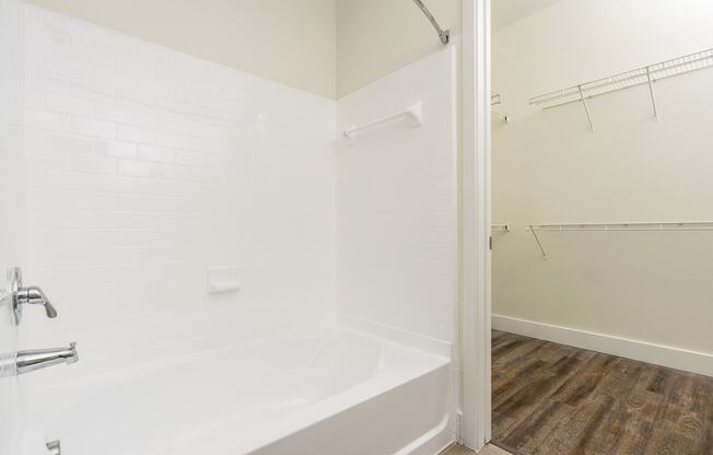 a bathroom with a bathtub and a shower