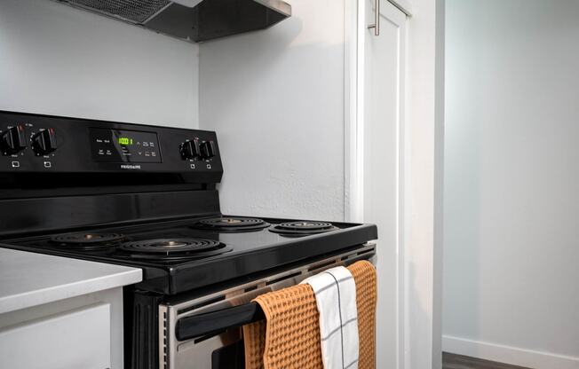 a kitchen with a stove and a microwave