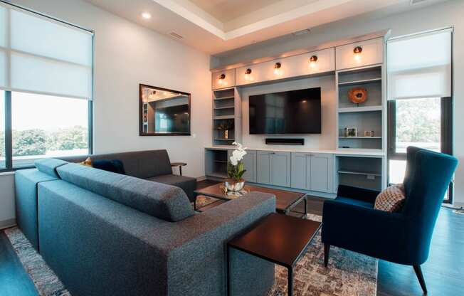 a living room with a couch and a tv at Barrington 101, Illinois