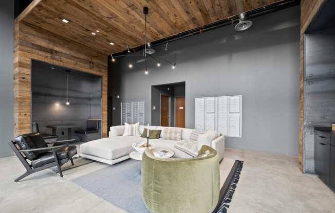 a living room with grey walls and a white couch and a table