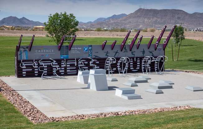 a sculpture of baseball bats on display in a park