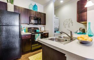 Modern Kitchen With Stainless Steel Appliances And Double Door Refrigerators at CLEAR Property Management , The Lookout at Comanche Hill, San Antonio