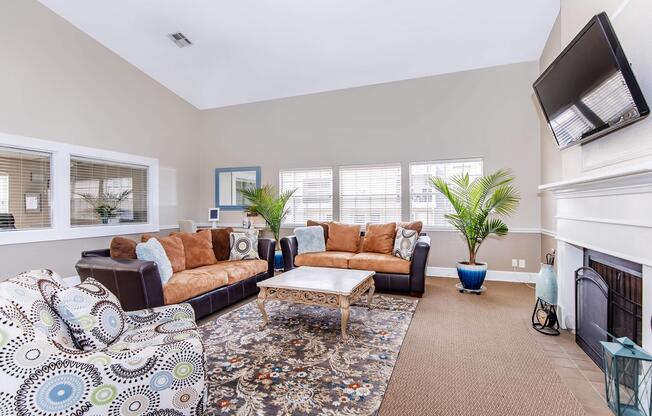 a living room filled with furniture and a window