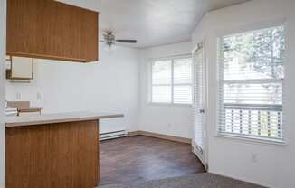 an empty kitchen and living room in an apartment