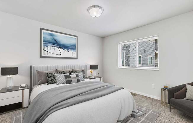 A bedroom with a large bed and a painting on the wall.