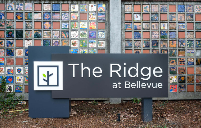 the ridge sign in front of a wall of tiles