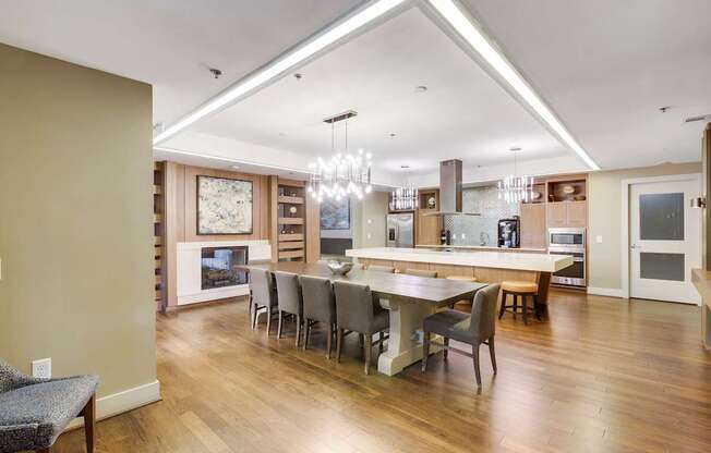 A modern kitchen with a dining table and chairs.