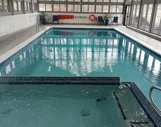 A swimming pool with a 3 feet deep sign.