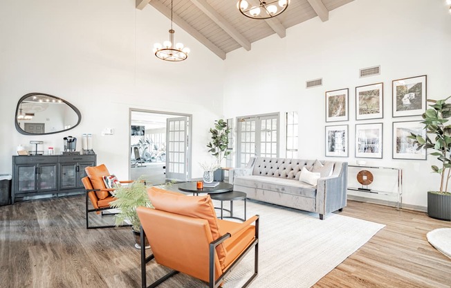 a living room with couches and chairs and a rug