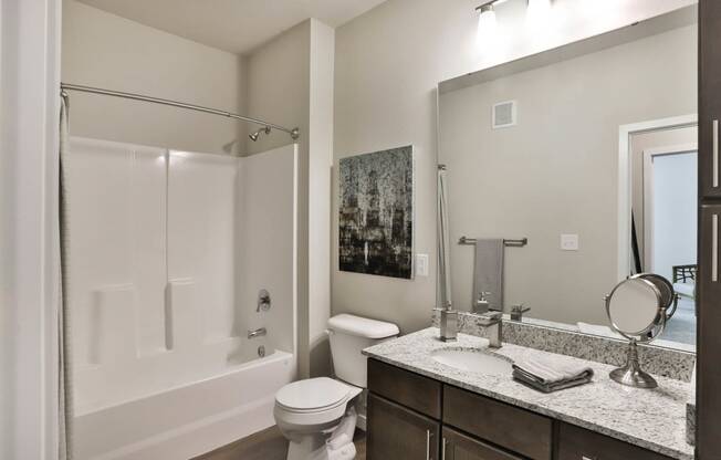 a bathroom with a shower toilet and sink at Aventura at Hawk Ridge, Lake St Louis, MO