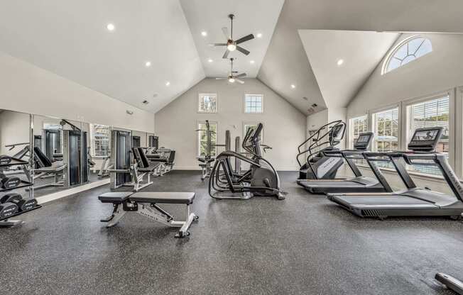 the gym is equipped with treadmills and other fitness equipment