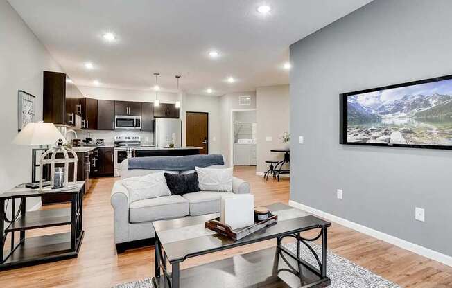 a living room with a couch and a table. Circle Pines, MN Lexington Lofts