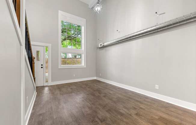 Industrial loft style living room at Crogman School Lofts, Atlanta, 30315