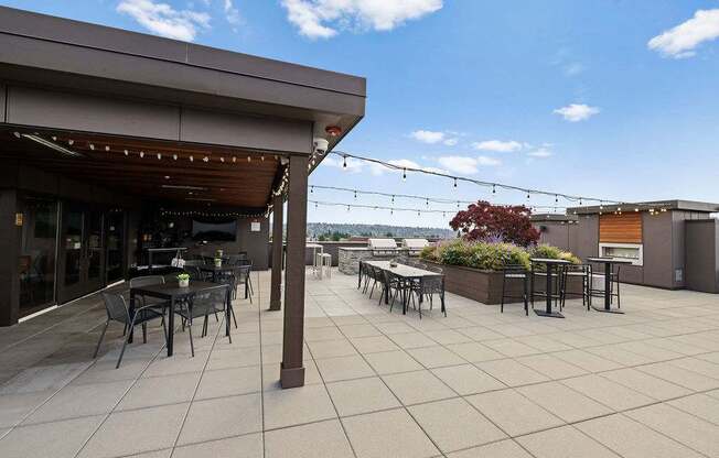 A patio with tables and chairs is shown.