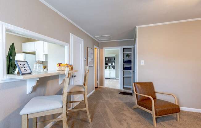 A living room with a chair and a table.