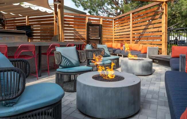 Outdoor Kitchen with Fire Pits and Couches