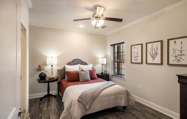 a bedroom with a bed and a ceiling fan  at Arlo Luxury homes Apartments, Little Rock, AR