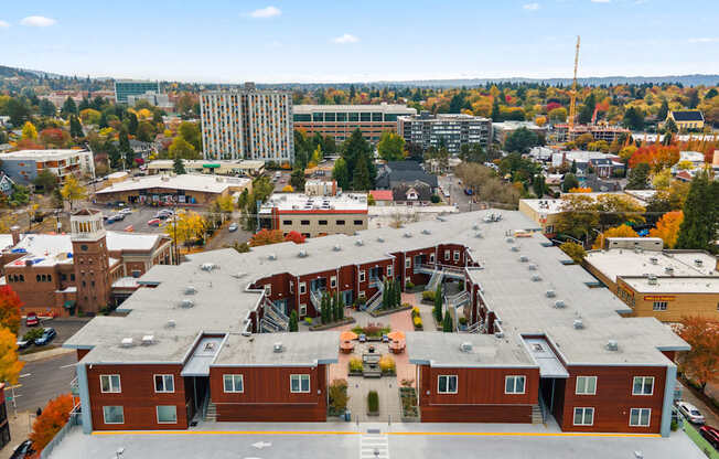 A large building with a parking lot in front of it.