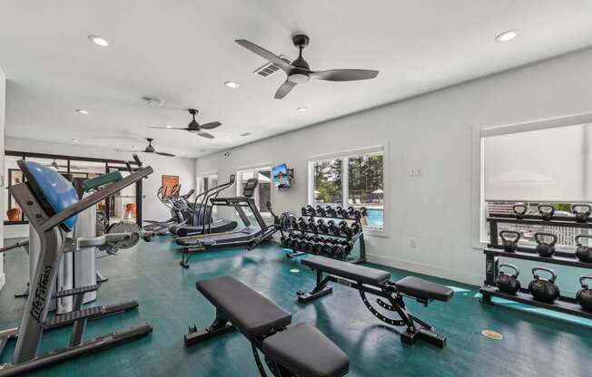 A well-equipped home gym with a variety of exercise equipment.