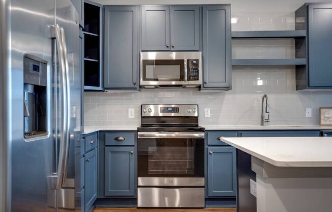 Alton Optimist Park Kitchen with Blue Cabinets