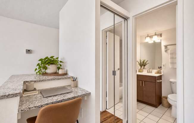 A bathroom with a sink and a mirror.