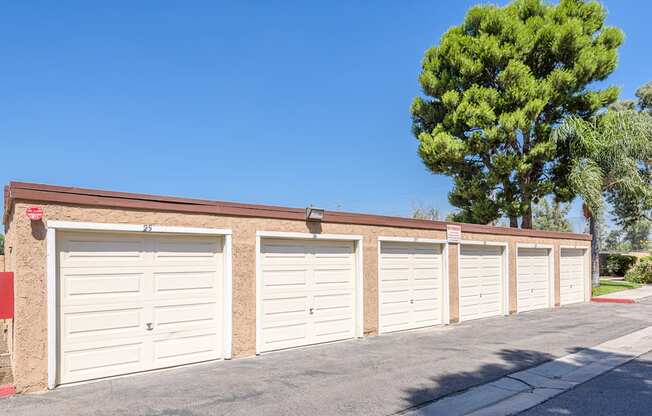 a row of garages at the side of a building