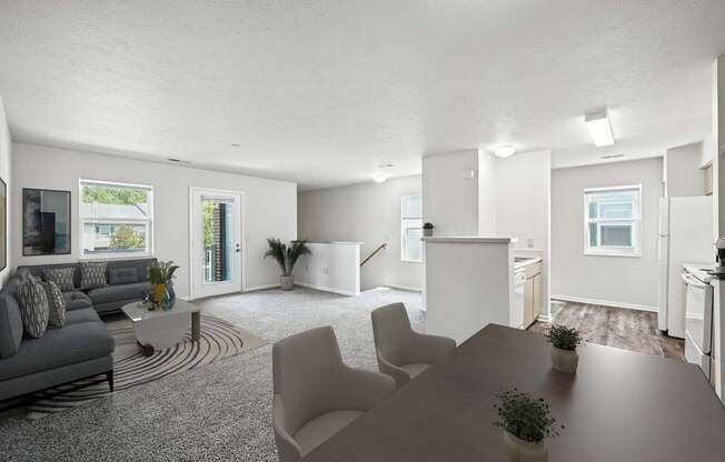 A modern living room with a grey sofa and a wooden dining table at Arbors at Georgetown Apartments, Lansing, MI