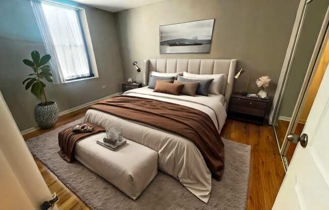 a bedroom with a bed and a rug