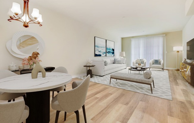 a living room and dining room with a table and chairs