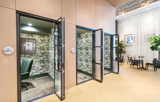Private work pods with acoustic design and glass-front doors, offering focused space for calls, creative work, and quiet productivity.
