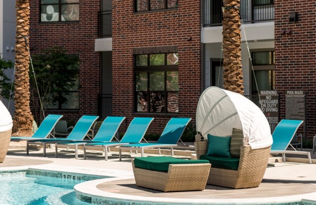 Shaded seating and lounge chairs near Swimming Pool | Tinsley on the Park | Luxury Apartments Houston