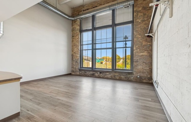 living room with a window and wood floors