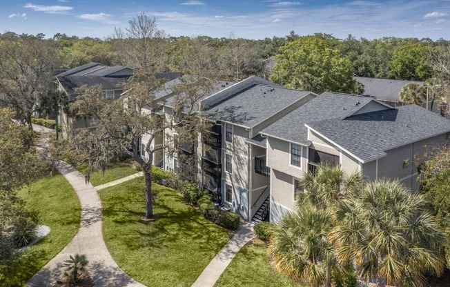 A residential area with houses and trees.