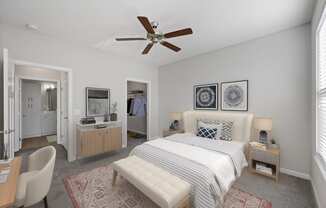 a bedroom with a bed and a ceiling fan