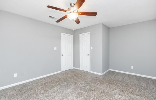 a bedroom with a bed and a mirror