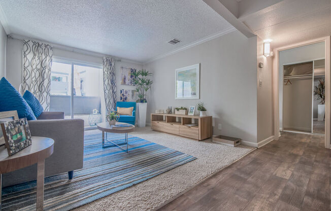 a living room with a geometric design on the wall at City View Apartments at Warner Center, Woodland Hills, 91367
