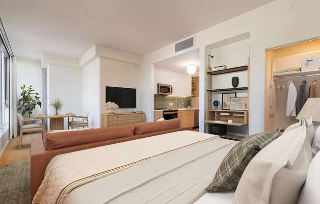 A bedroom with a large bed and a living area in the background at Allied Harbor Point, Baltimore