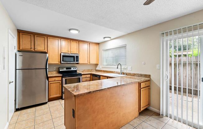 a kitchen with a stove top oven sitting inside of a building