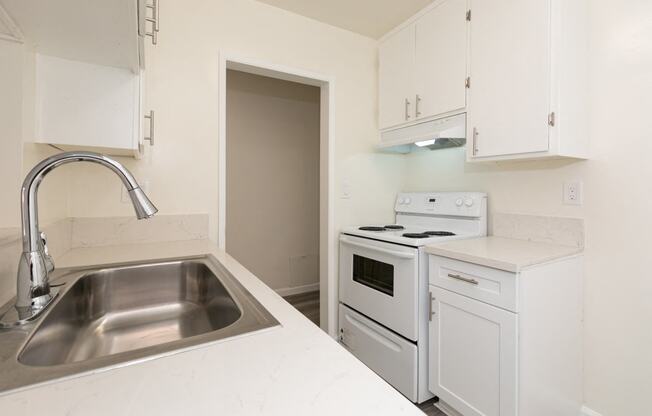 Kitchen with White Appliances and White Cabinets