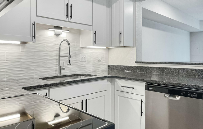 Experience luxury and functionality in this beautifully designed modern kitchen.