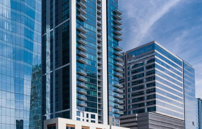 Street-level view of a Modera McGavock with glass-forward architecture, private balconies, and a prime downtown location connecting residents to Nashville.