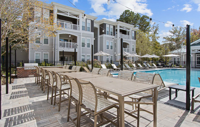 our apartments offer a swimming pool and a patio with chairs