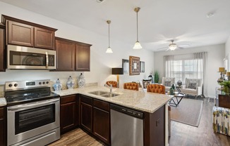 Kitchen with stainless steel appliances and a granite counter top