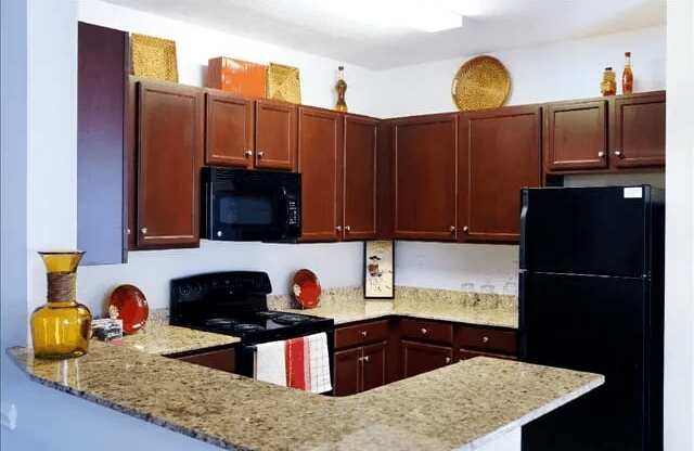 Kitchen with Granite Counters at Village on the Lake Apartments, Spring Lake, NC, 28390