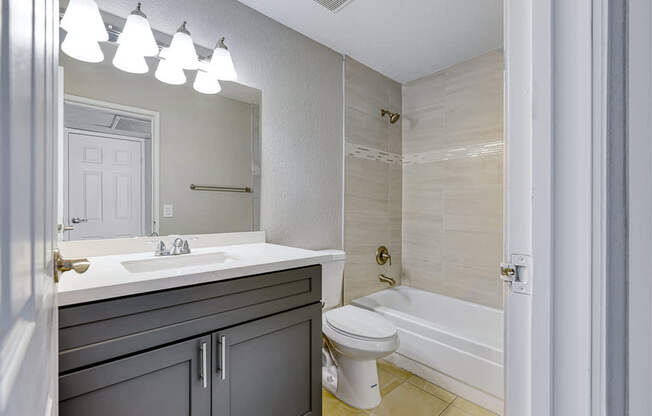 a bathroom with a sink toilet and a tub