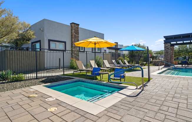 our apartments have a resort style pool and lounge chairs