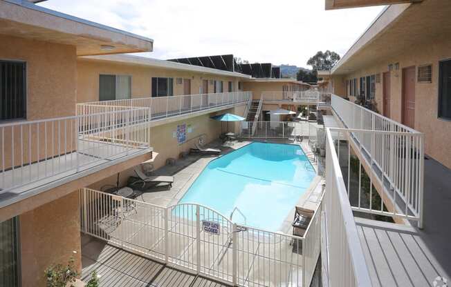 Second floor view of large solar heated pool in Woodbridge Park courtyard.