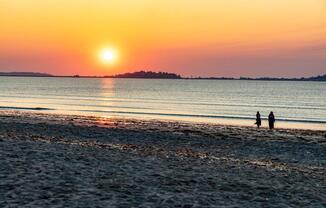 Revere Beach sunsets set the tone for tranquil evenings, with golden skies and gentle waves just steps from home.