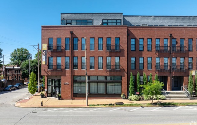 a red brick building on the corner of a street