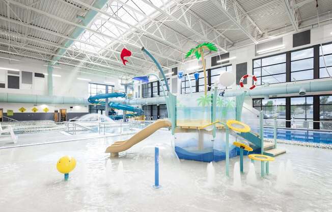 A water play area with slides and water sprays.